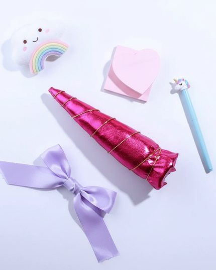 fuchsia unicorn horn - flat-lay