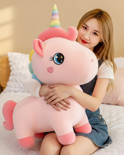 giant pink unicorn plush stuffed animal - in-use