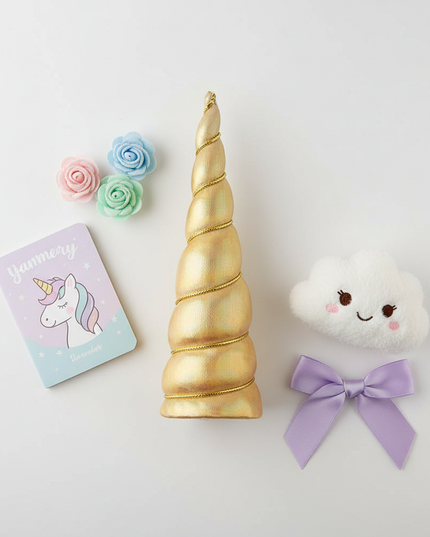 gold iridescent unicorn horn - flat-lay
