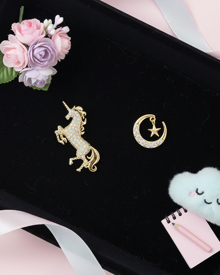 gold unicorn earrings for sale - flat-lay