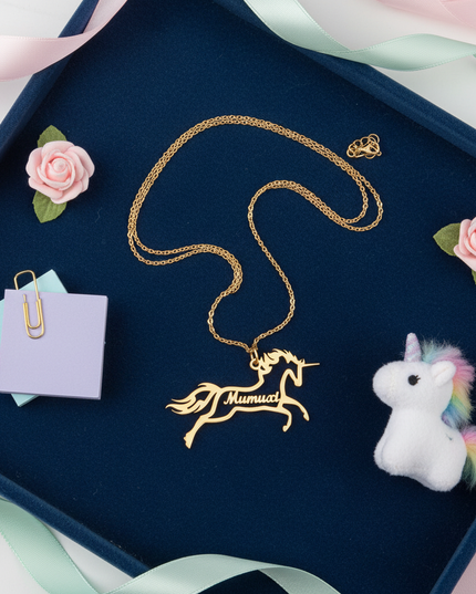 gold unicorn name necklace - flat-lay