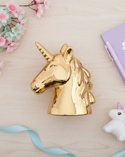 gold unicorn piggy bank - flat-lay