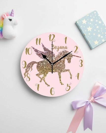 gold unicorn wall clock - flat-lay