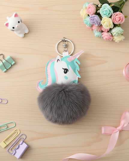 gray unicorn keychain - flat-lay