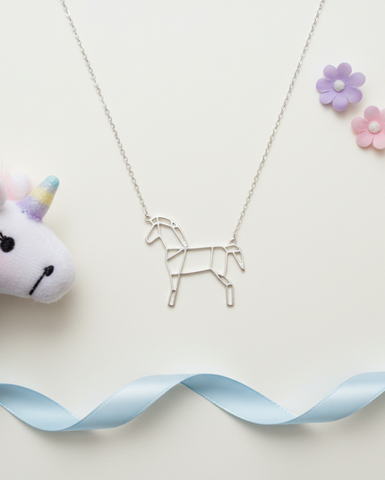 horse unicorn necklace - flat-lay