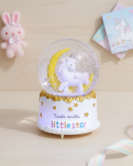 large unicorn snow globe - flat-lay
