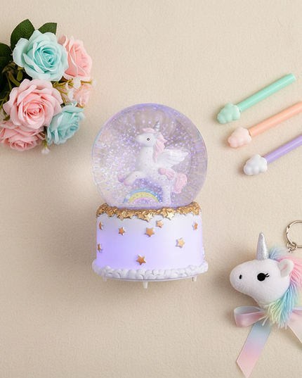 light up unicorn snow globe - flat-lay
