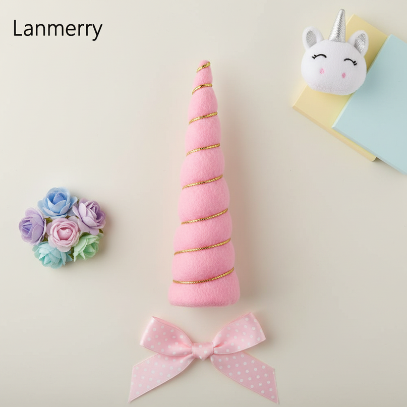 pink felt unicorn horn set - flat-lay