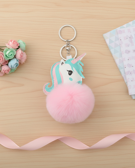 pink fluffy unicorn keychain - flat-lay