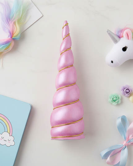 pink iridescent unicorn horn - flat-lay