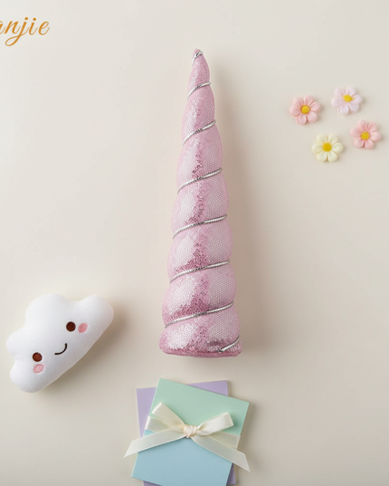 pink sequin unicorn horn - flat-lay