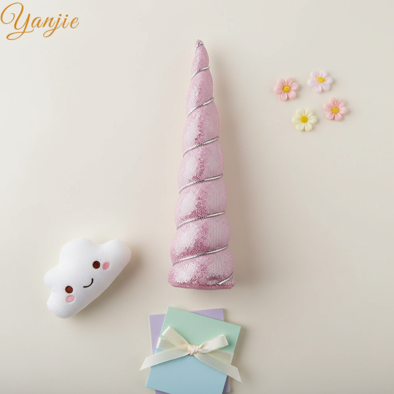 pink sequin unicorn horn - flat-lay