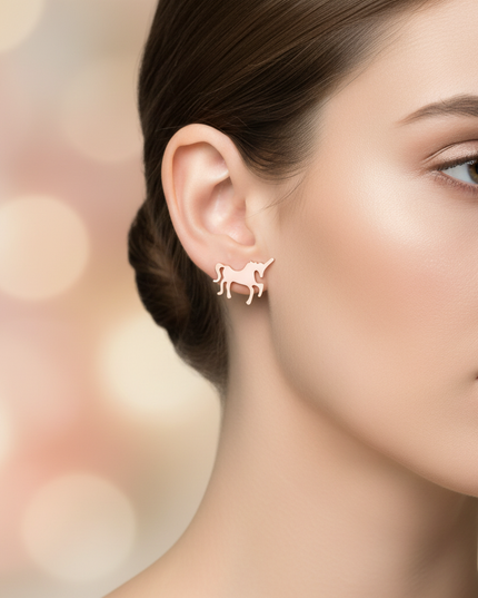 pink steel unicorn earrings - in-use