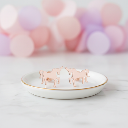 pink steel unicorn earrings - lifestyle