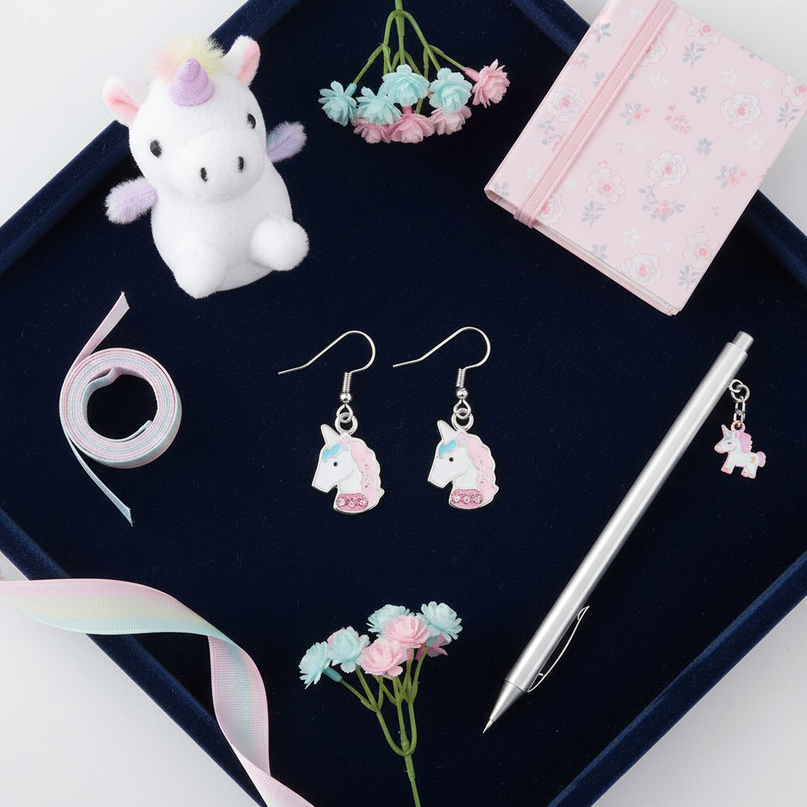 pink unicorn hoop earrings - flat-lay