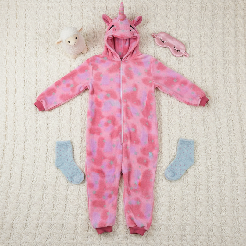 pink unicorn onesie adults - flat-lay
