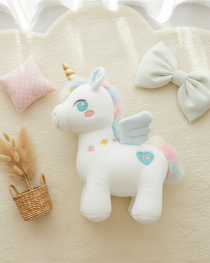 pink unicorn plush stuffed animal - flat-lay