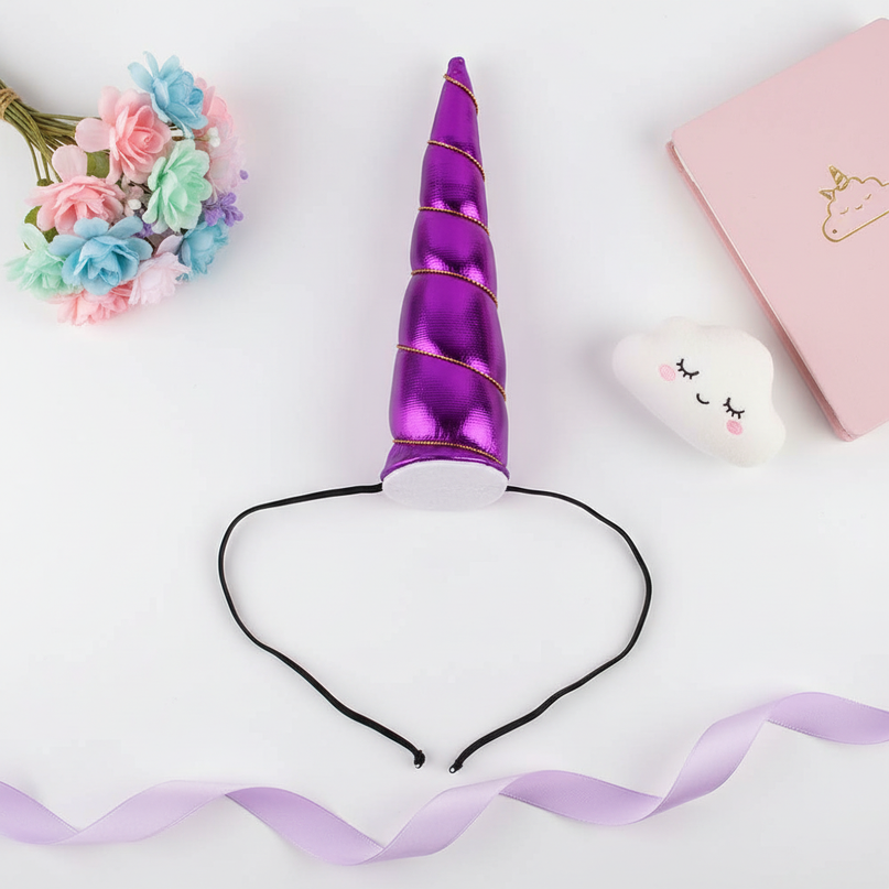 purple elastic unicorn horn - flat-lay