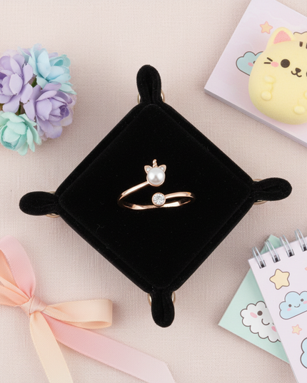 rose gold unicorn ring - flat-lay