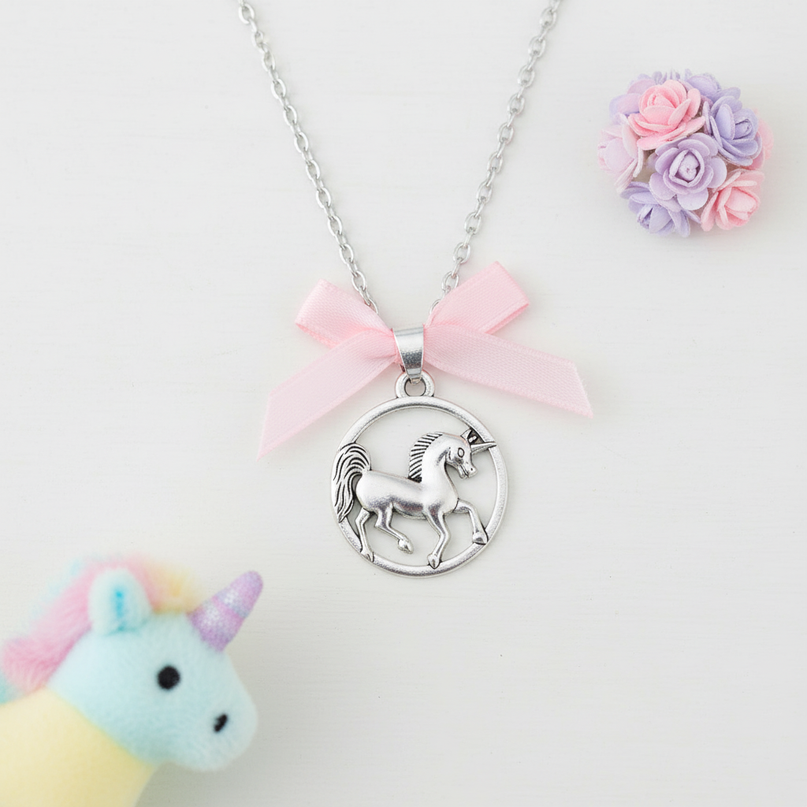 round unicorn necklace - flat-lay