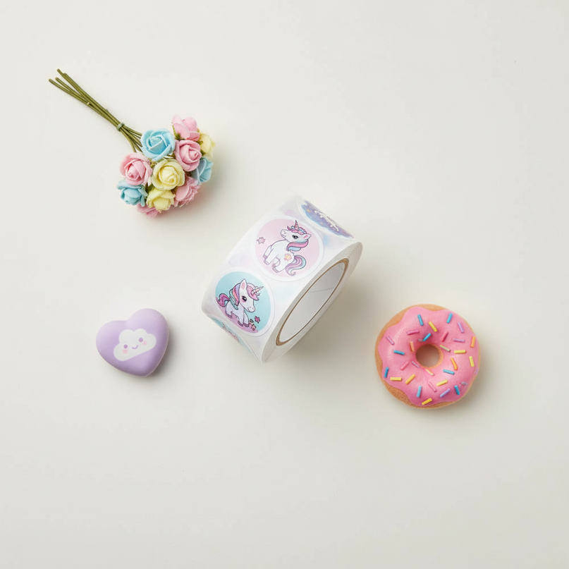 round unicorn stickers - flat-lay