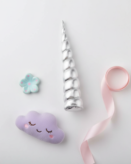 silver unicorn horn clip - flat-lay