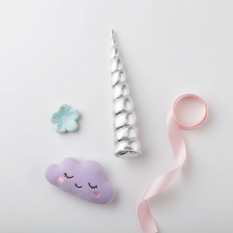 silver unicorn horn clip - flat-lay