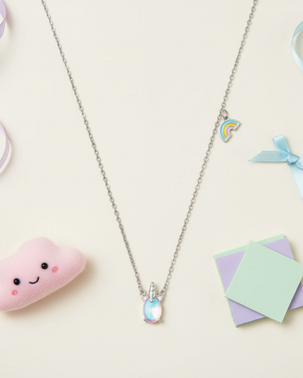 silver unicorn pendant - flat-lay