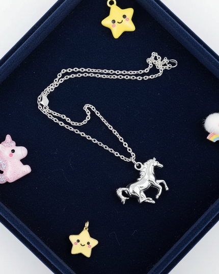 silver unicorn pendant necklace - flat-lay