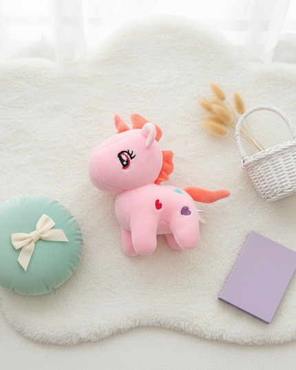 small unicorn plush - flat-lay