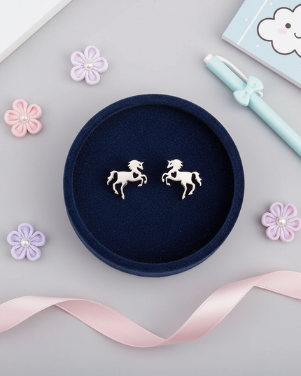 stainless steel unicorn earrings - flat-lay
