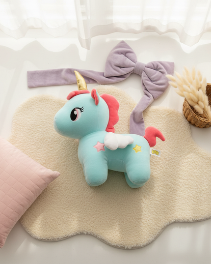 teal unicorn plush - flat-lay