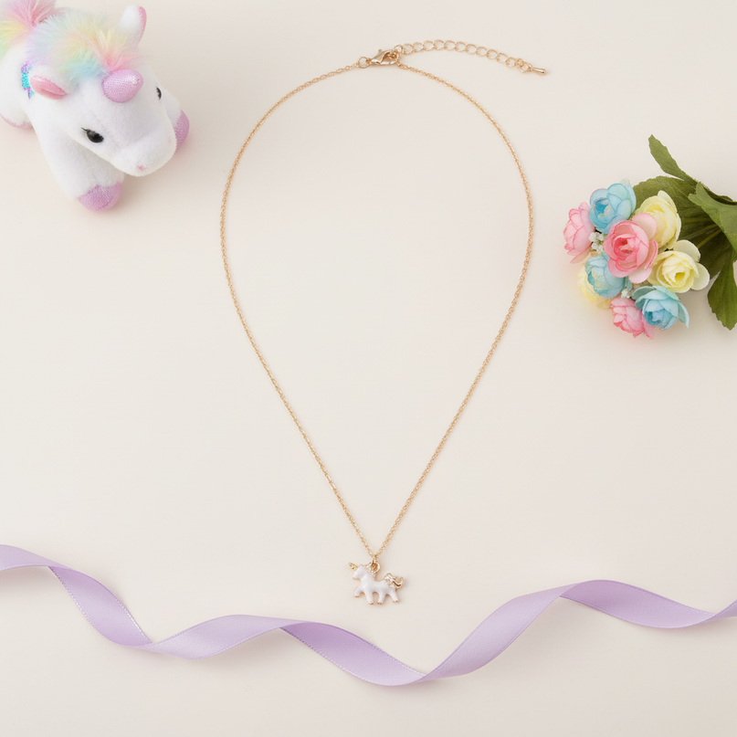 tiny unicorn necklace - flat-lay