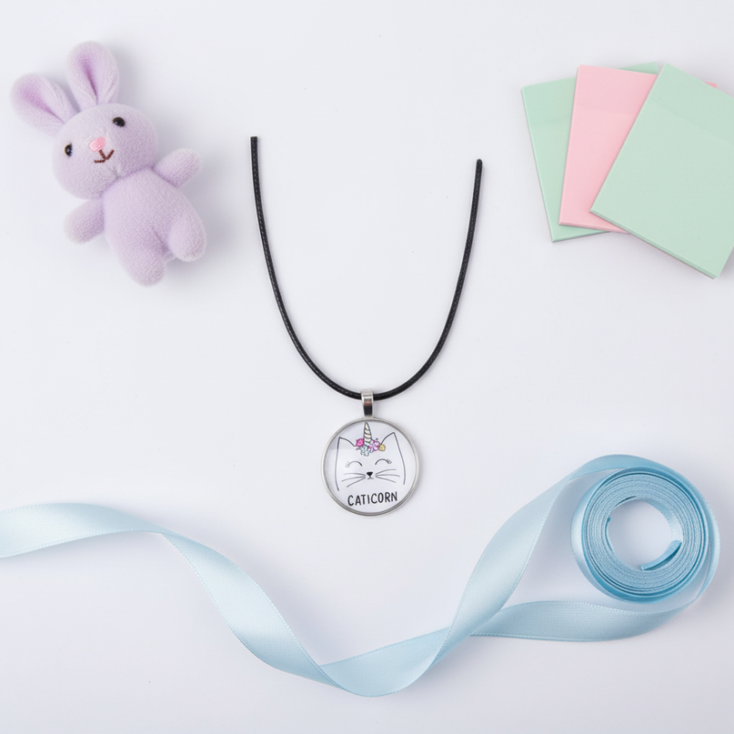 unicorn cat necklace - flat-lay