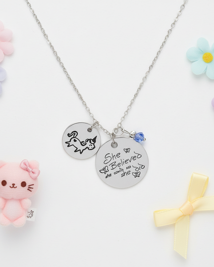 unicorn charm necklace - flat-lay