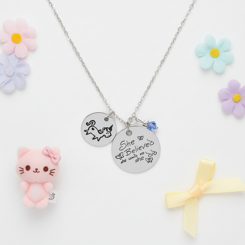 unicorn charm necklace - flat-lay