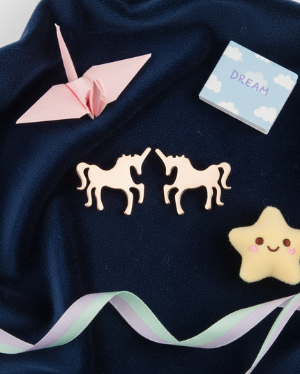 unicorn earrings for birthday - flat-lay