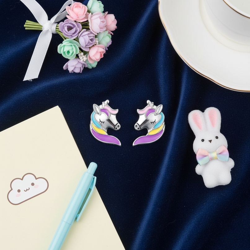 unicorn head earrings - flat-lay
