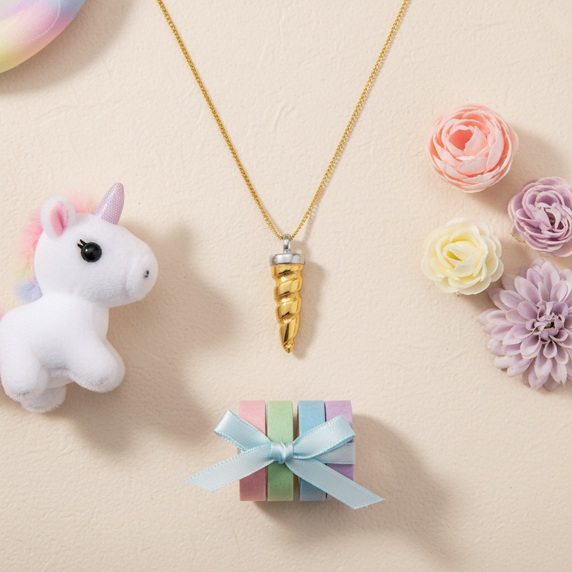 unicorn horn pendant - flat-lay