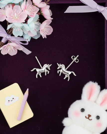 unicorn post earrings - flat-lay