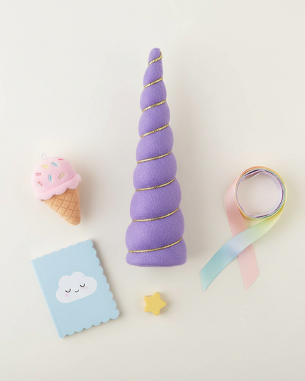 violet unicorn horn - flat-lay