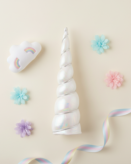 white iridescent unicorn horn - flat-lay
