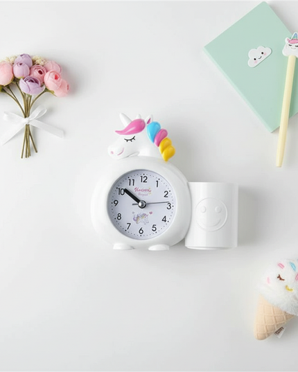 white unicorn alarm clock - flat-lay