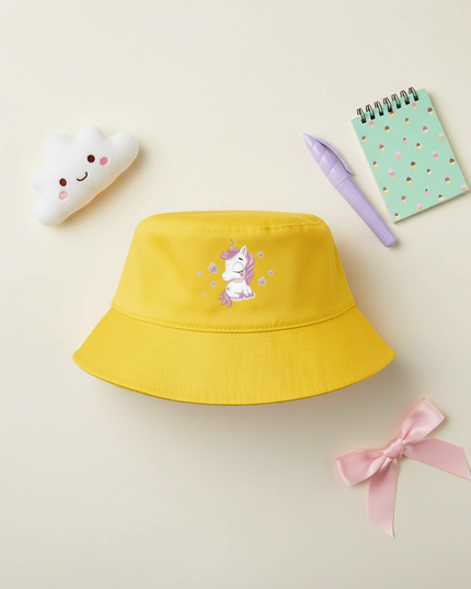 yellow unicorn bucket hat - flat-lay